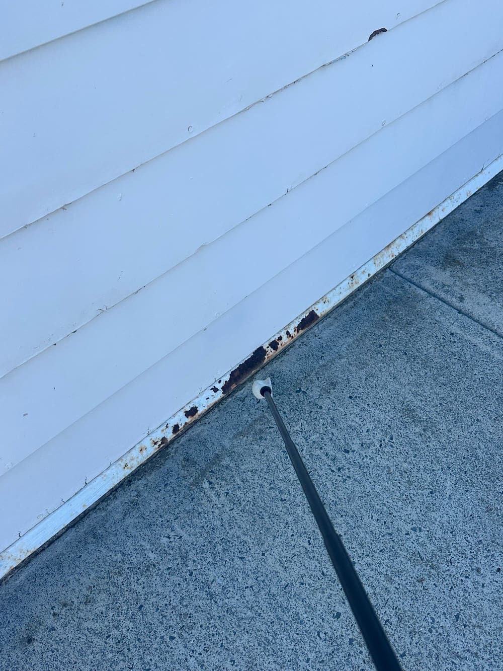Damaged/rusted termite shield, recorded during a building and pest inspection in Eagleby
